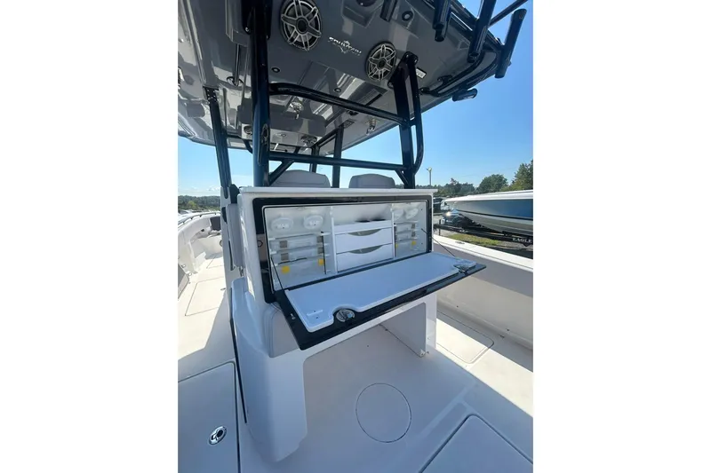  Yacht Photos Pics 2023 Fountain 38TE CC boat interior with storage compartments and speakers.