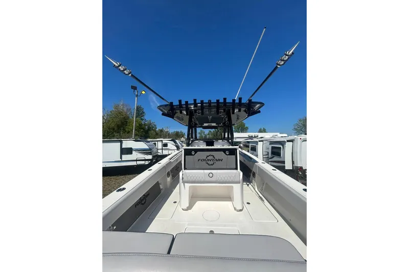  Yacht Photos Pics 2023 Fountain 38TE CC boat interior with fishing rod holders and seating.
