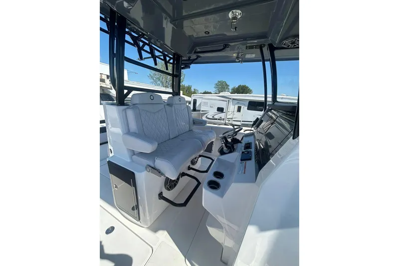  Yacht Photos Pics 2023 Fountain 38TE CC boat interior with modern seating and control panel.