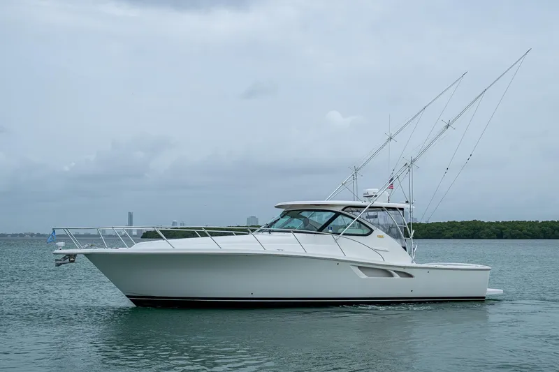 Wahoo Yacht Photos Pics 2009 Tiara Yachts 39 Open boat on calm water, side view.