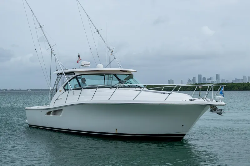 Wahoo Yacht Photos Pics 2009 Tiara Yachts 39 Open boat on calm water with city skyline in background.