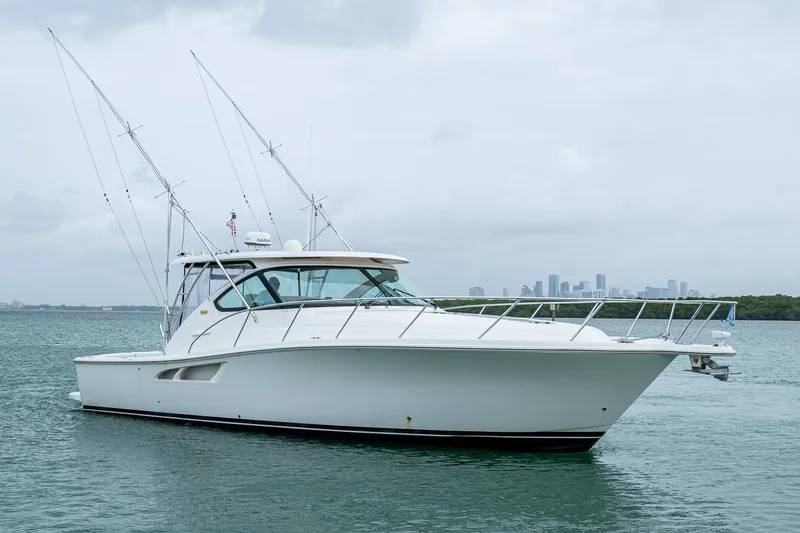 Wahoo Yacht Photos Pics 2009 Tiara Yachts 39 Open boat on calm water with city skyline in background.