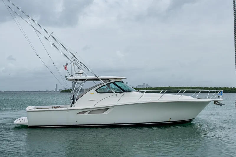 Wahoo Yacht Photos Pics 2009 Tiara Yachts 39 Open cruising on calm waters under cloudy skies.