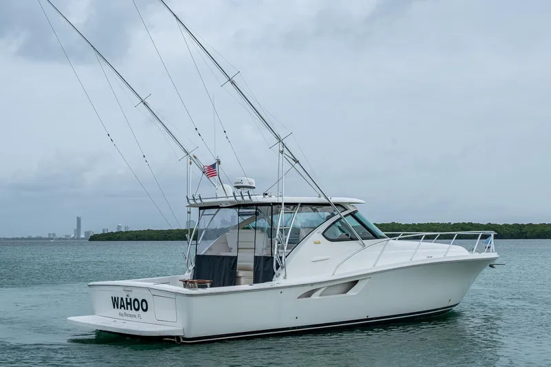 Wahoo Yacht Photos Pics 2009 Tiara Yachts 39 Open boat on water, with fishing rods and American flag.