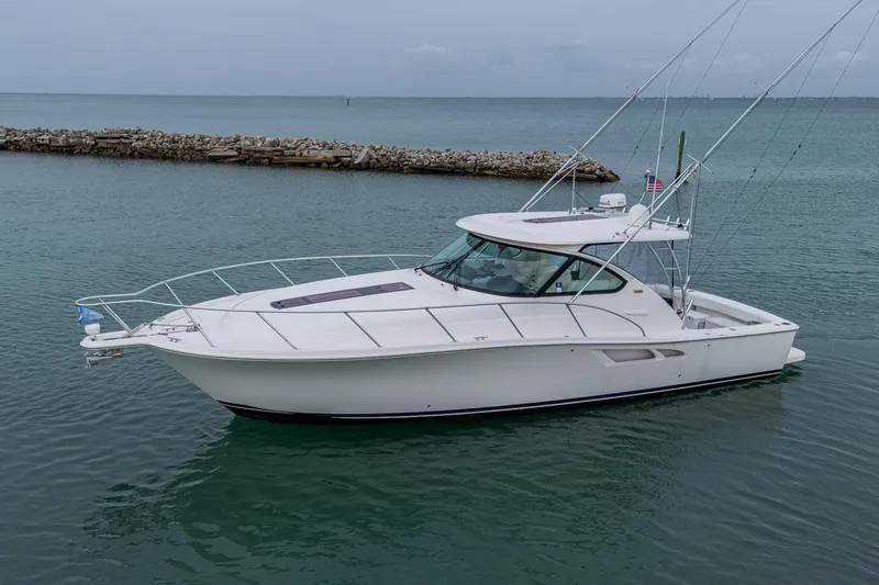 Wahoo Yacht Photos Pics 2009 Tiara Yachts 39 Open boat on calm water, side view.