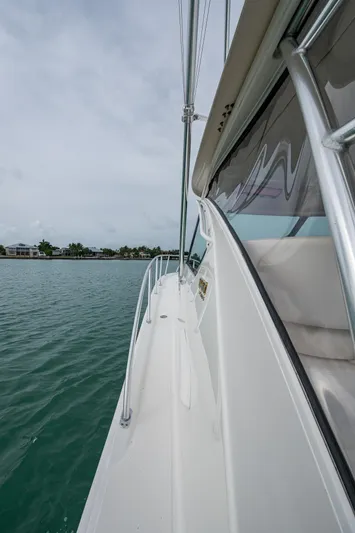 Wahoo Yacht Photos Pics 2009 Tiara Yachts 39 Open, side view on water, showcasing sleek design and craftsmanship.