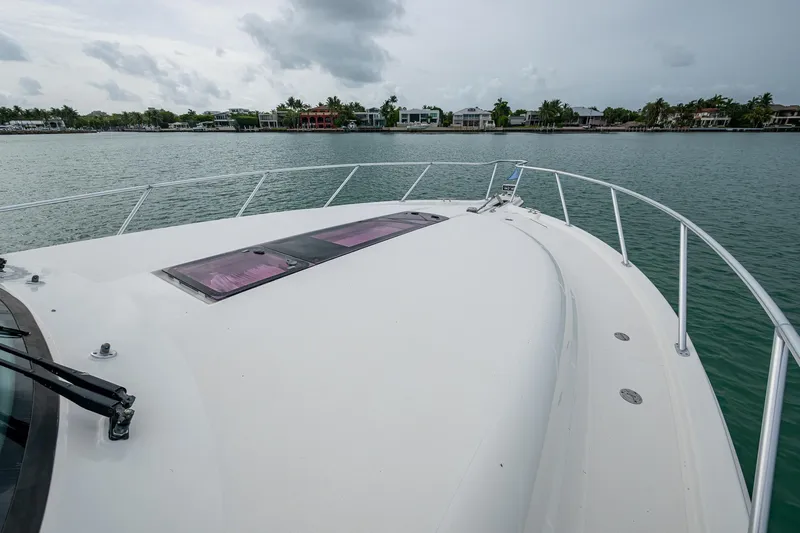 Wahoo Yacht Photos Pics 2009 Tiara Yachts 39 Open bow view on calm water with cloudy sky.