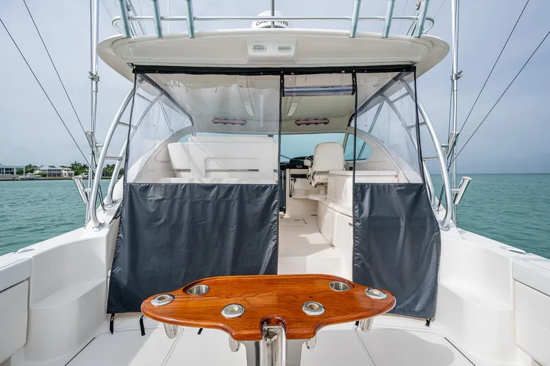 Wahoo Yacht Photos Pics 2009 Tiara Yachts 39 Open boat interior with seating and wooden table, ocean view.
