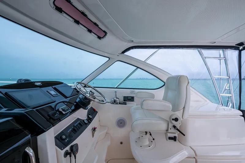 Wahoo Yacht Photos Pics 2009 Tiara Yachts 39 Open helm with ocean view, featuring modern controls and seating.