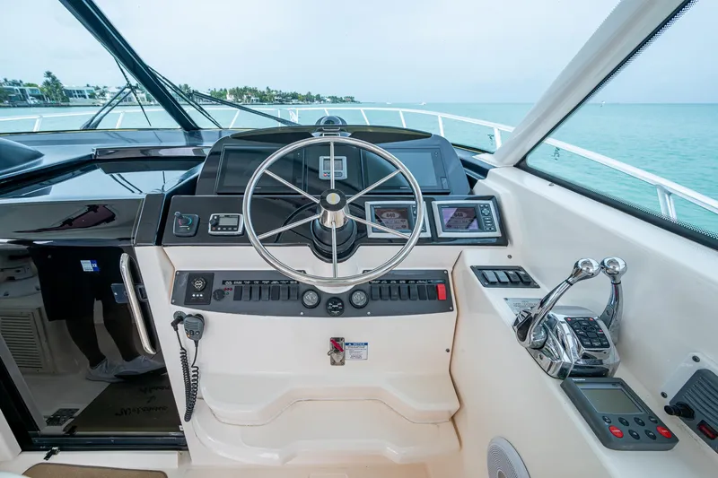 Wahoo Yacht Photos Pics 2009 Tiara Yachts 39 Open helm with steering wheel and navigation controls.