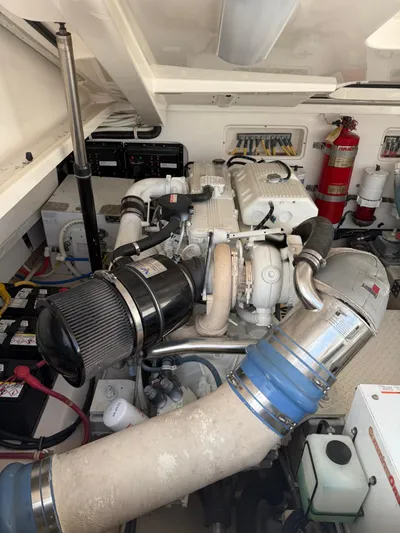 Wahoo Yacht Photos Pics Engine room of 2009 Tiara Yachts 39 Open, featuring mechanical components and fire extinguisher.