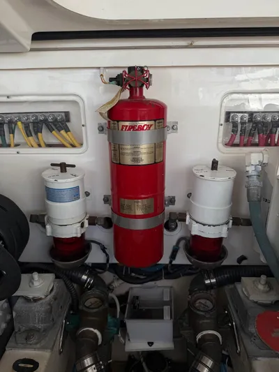 Wahoo Yacht Photos Pics Engine room of 2009 Tiara Yachts 39 Open with fire extinguisher and filters.