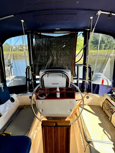 Second Wind Yacht Photos Pics 2006 Island Packet 440 sailboat cockpit with steering wheel.