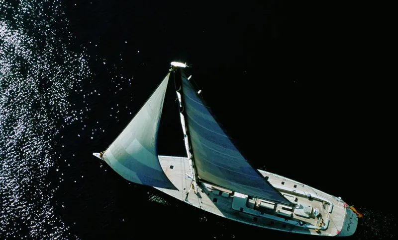 Syl Yacht Photos Pics Aerial view of a 2003 Custom SYL sailboat on shimmering water.