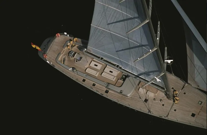 Syl Yacht Photos Pics Aerial view of a 2003 Custom SYL sailing yacht with sleek wooden deck.