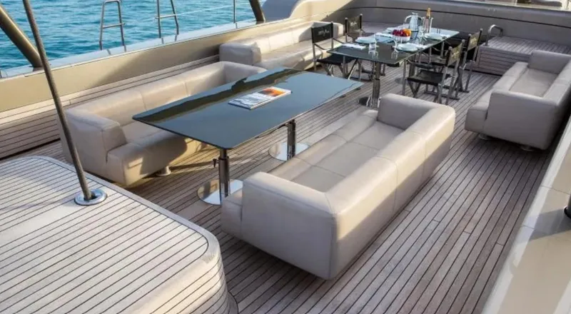 Syl Yacht Photos Pics Luxurious yacht deck with elegant seating and dining area, Custom SYL - BARCOS DEPORTIVOS, 2003.