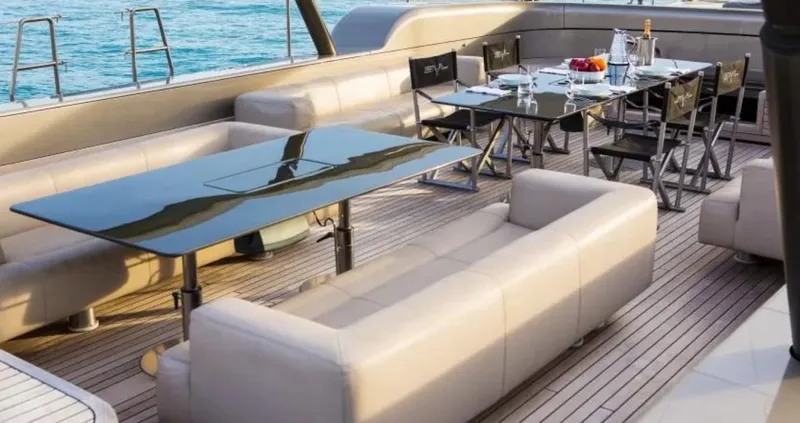 Syl Yacht Photos Pics Luxurious yacht deck with elegant seating and dining area, Custom SYL - BARCOS DEPORTIVOS, 2003.