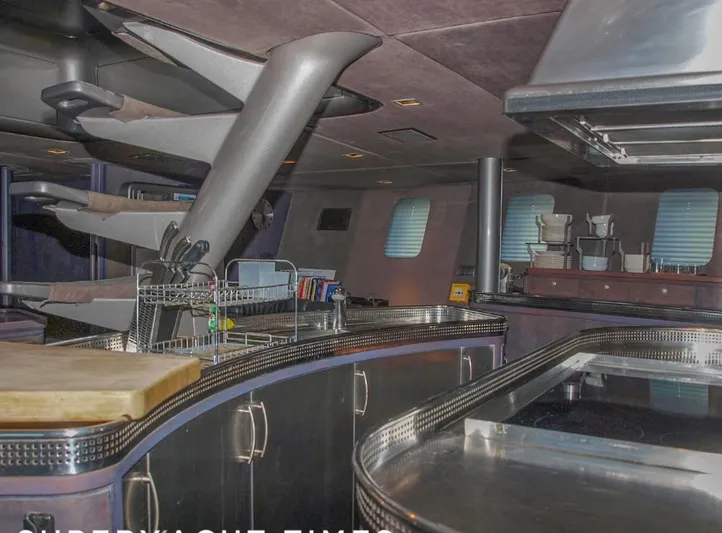 Syl Yacht Photos Pics Luxurious yacht interior with modern kitchen, sleek design, and stainless steel appliances, 2003 model.