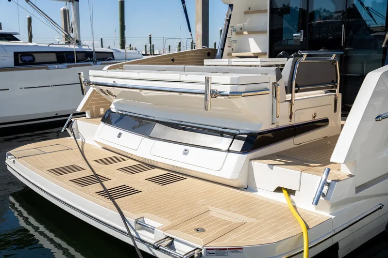  Yacht Photos Pics 2025 Galeon 400 Fly yacht with spacious deck and modern design at a marina.