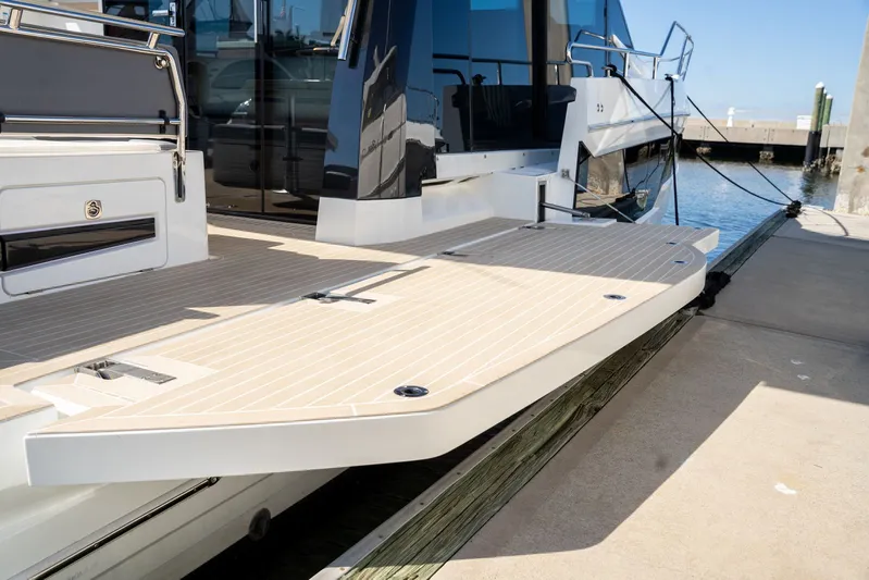  Yacht Photos Pics 2025 Galeon 400 Fly yacht docked, showcasing sleek deck design and modern features.