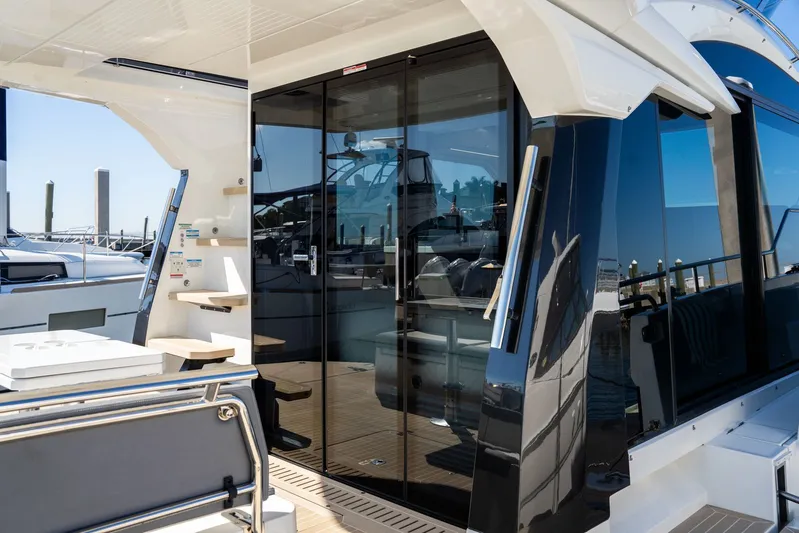  Yacht Photos Pics 2025 Galeon 400 Fly yacht with sleek design and modern glass doors.