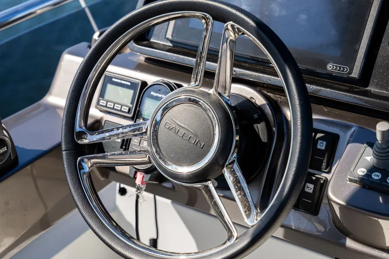  Yacht Photos Pics Steering wheel of 2025 Galeon 400 Fly yacht with control panel and instruments.