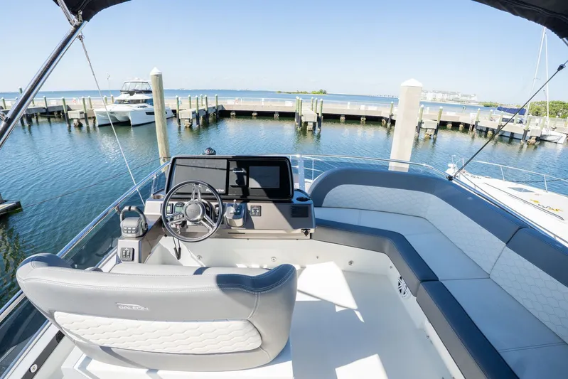  Yacht Photos Pics 2025 Galeon 400 Fly yacht helm with luxurious seating and waterfront view.