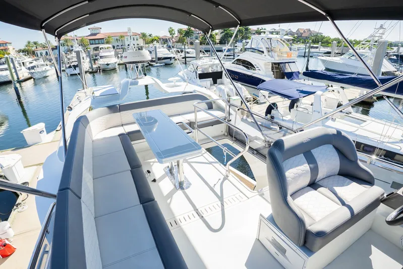  Yacht Photos Pics Luxurious 2025 Galeon 400 Fly yacht interior at marina, featuring elegant seating and sleek design.