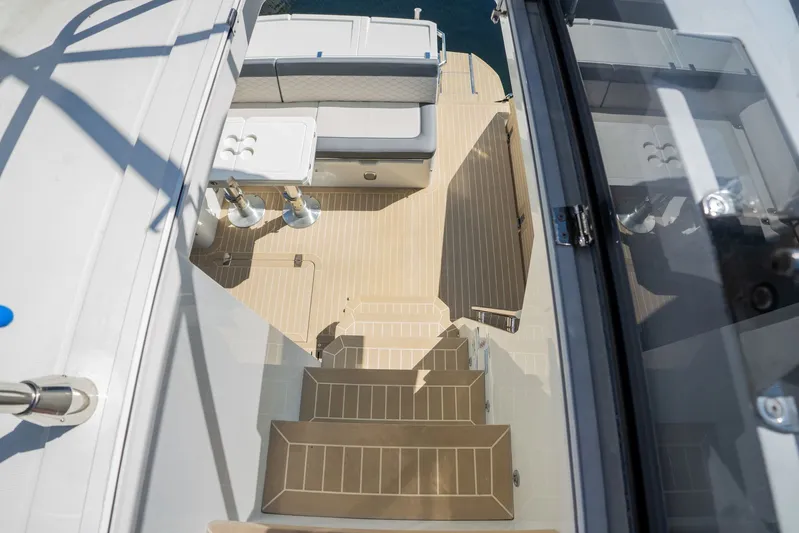  Yacht Photos Pics 2025 Galeon 400 Fly yacht interior with seating and table, viewed from above.