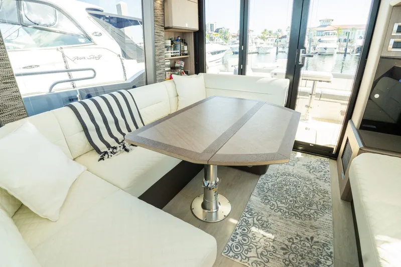  Yacht Photos Pics Luxurious interior of 2025 Galeon 400 Fly yacht with elegant seating and table.