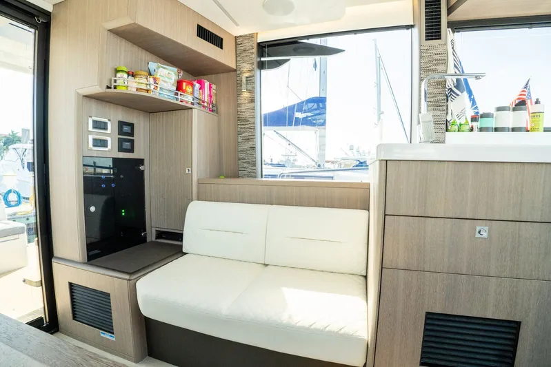  Yacht Photos Pics Modern interior of 2025 Galeon 400 Fly yacht with cozy seating and storage.