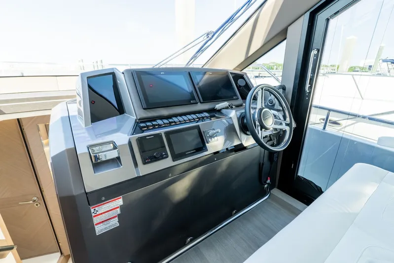  Yacht Photos Pics Helm station of 2025 Galeon 400 Fly yacht with modern navigation equipment.