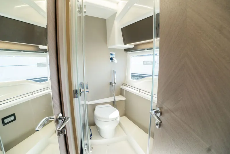  Yacht Photos Pics Modern bathroom in 2025 Galeon 400 Fly yacht with sleek design and glass door.