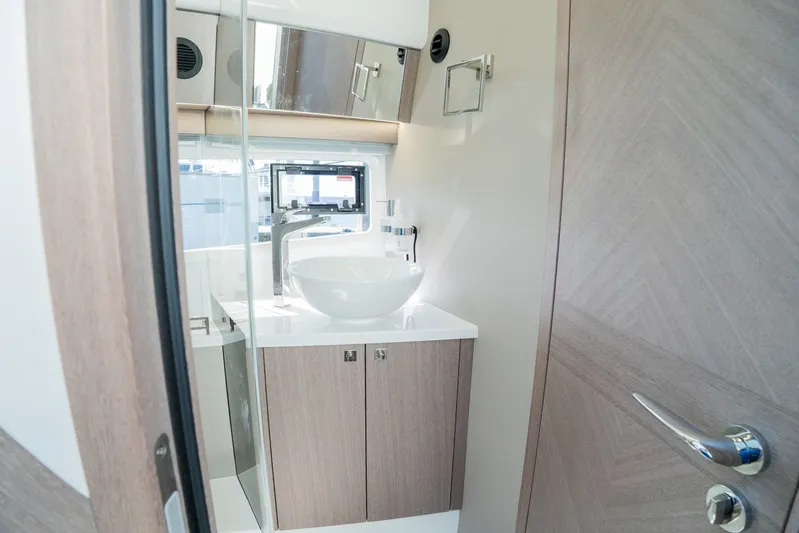  Yacht Photos Pics Modern bathroom interior on 2025 Galeon 400 Fly yacht, featuring sleek sink and cabinetry.