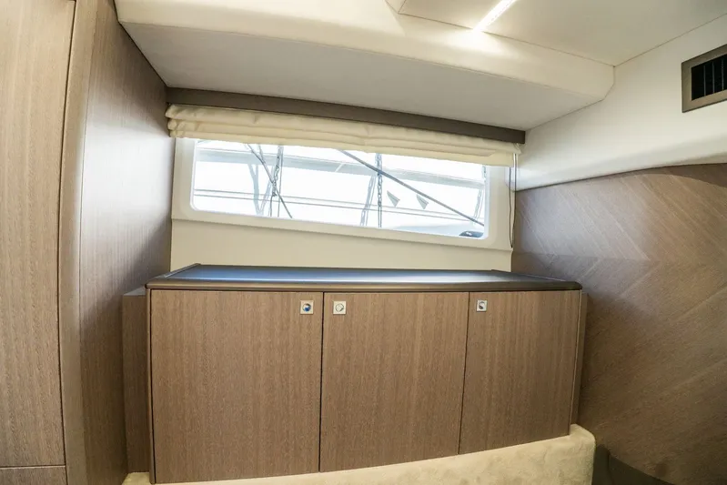  Yacht Photos Pics Interior of 2025 Galeon 400 Fly yacht with wooden cabinetry and window.