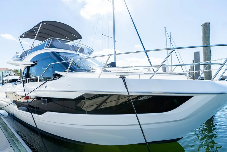  Yacht Photos Pics 2025 Galeon 400 Fly yacht docked at marina under clear sky.