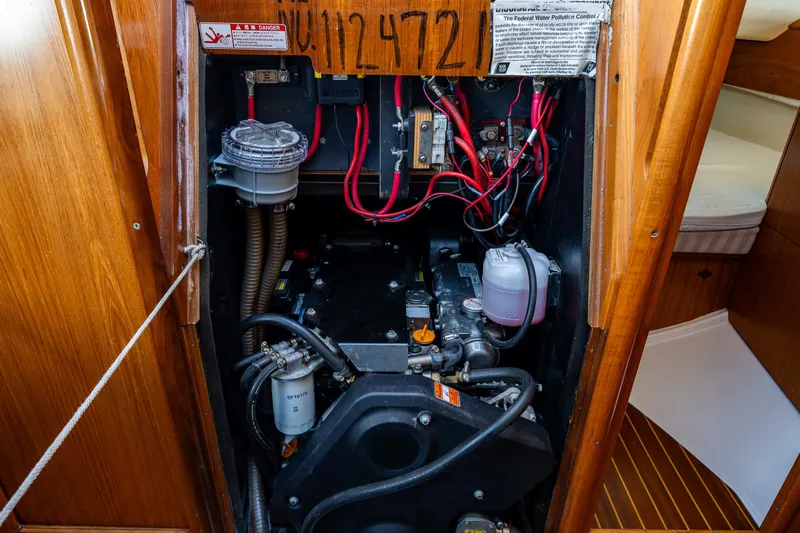 Salus Yacht Photos Pics Engine compartment of 2001 Jeanneau Sun Odyssey 40 sailboat, showcasing wiring and components.