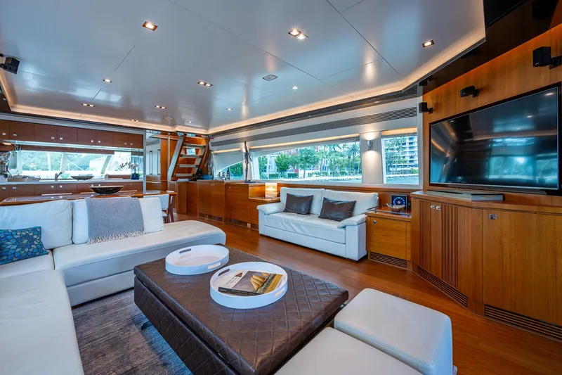 Satori Yacht Photos Pics Luxurious interior of 2016 Horizon E88 yacht with modern furnishings and large windows.