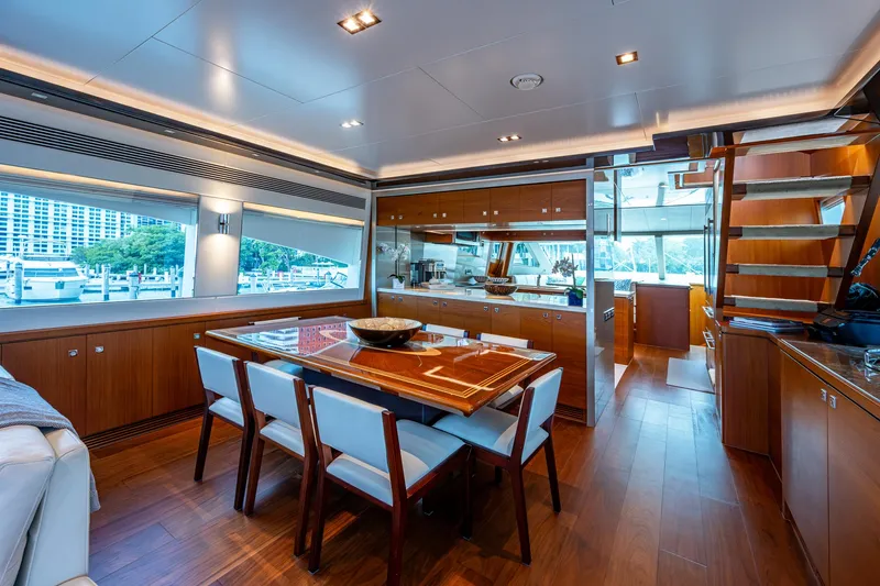 Satori Yacht Photos Pics Luxurious interior of 2016 Horizon E88 yacht with dining area and modern kitchen.