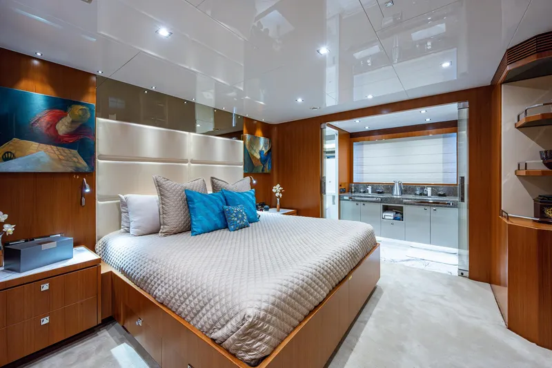 Satori Yacht Photos Pics Luxurious bedroom on a 2016 Horizon E88 yacht with modern decor and ensuite bathroom.