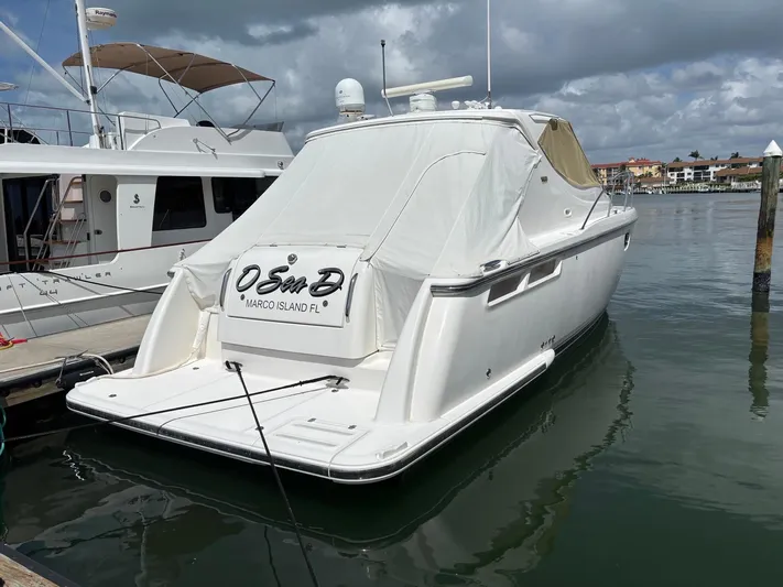 O Sea D Yacht Photos Pics 2008 Tiara Yachts 3900 Sovran docked at marina under cloudy skies.