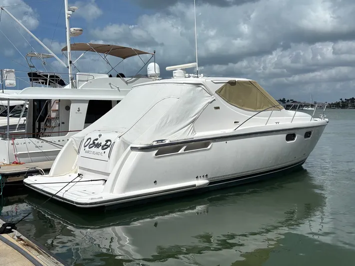 O Sea D Yacht Photos Pics 2008 Tiara Yachts 3900 Sovran docked in a marina under cloudy skies.