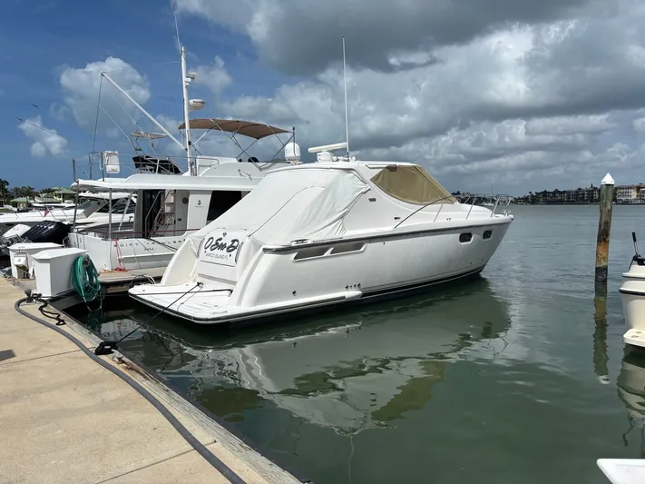 O Sea D Yacht Photos Pics 2008 Tiara Yachts 3900 Sovran docked in a marina under cloudy skies.