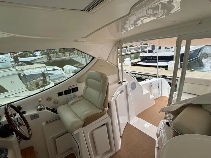 O Sea D Yacht Photos Pics 2008 Tiara Yachts 3900 Sovran interior with helm, seating, and marina view.