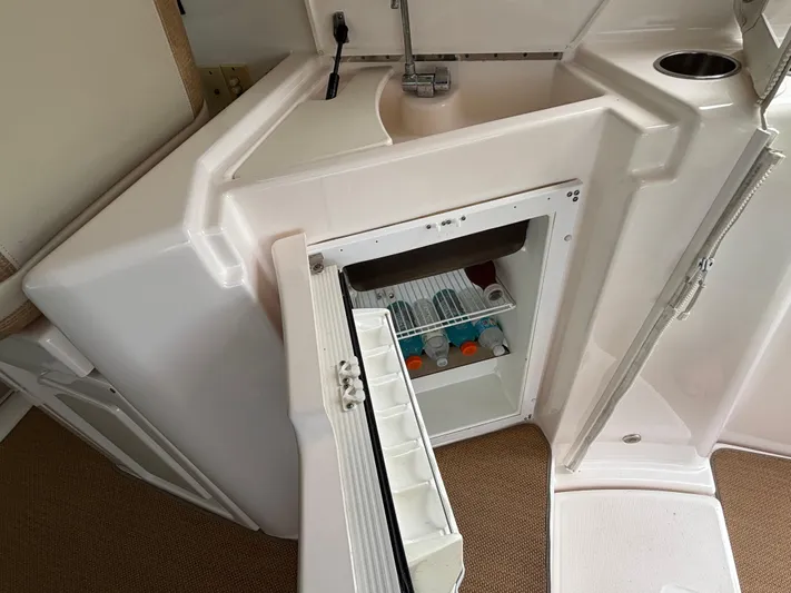 O Sea D Yacht Photos Pics 2008 Tiara Yachts 3900 Sovran interior with open mini fridge and sink.