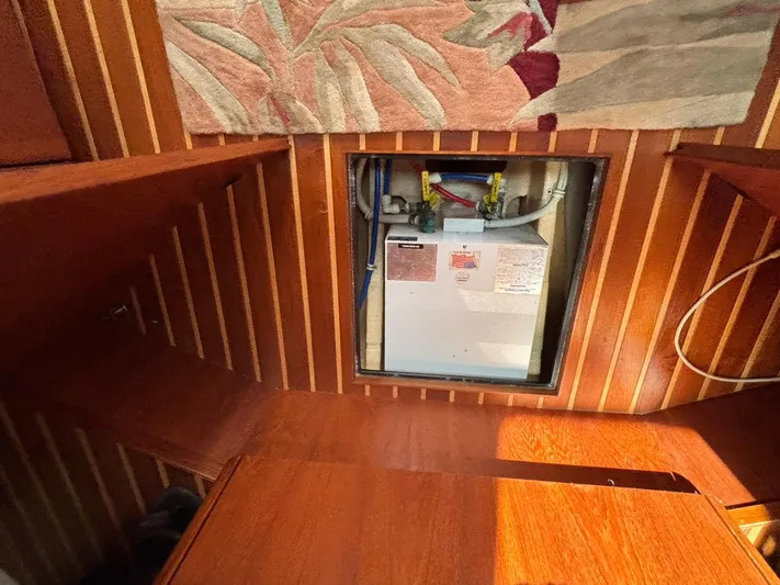 O Sea D Yacht Photos Pics 2008 Tiara Yachts 3900 Sovran interior with wooden paneling and equipment access.