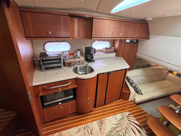 O Sea D Yacht Photos Pics Luxurious 2008 Tiara Yachts 3900 Sovran interior with kitchenette and seating area.