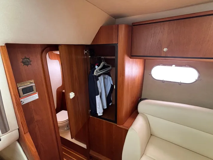 O Sea D Yacht Photos Pics 2008 Tiara Yachts 3900 Sovran interior with wooden closet, clothes, and seating area.
