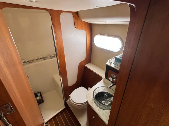O Sea D Yacht Photos Pics 2008 Tiara Yachts 3900 Sovran bathroom with wood accents and modern fixtures.
