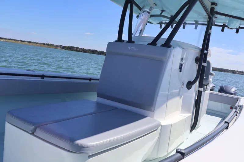 Wine Down Yacht Photos Pics 2017 Contender 35 ST boat interior with seating, on calm water.